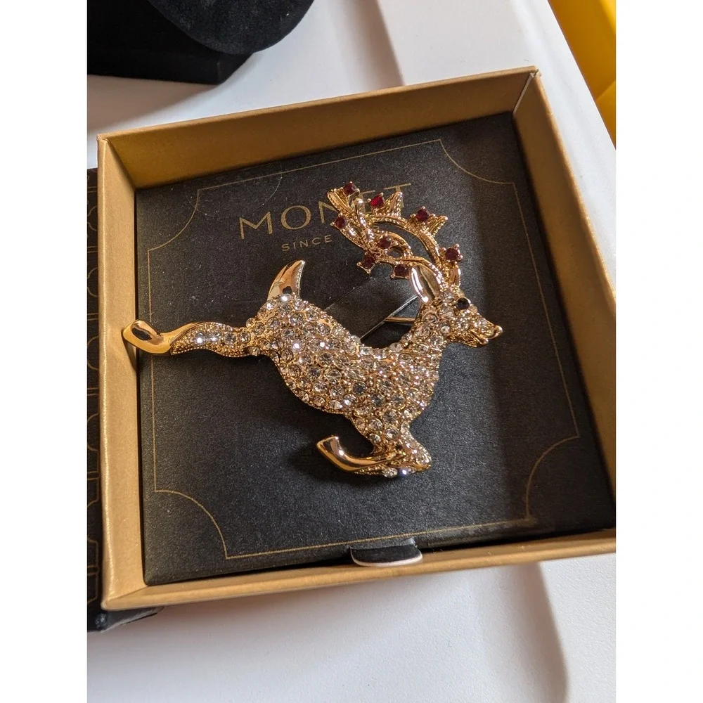 VINTAGE MONET SIGNED Leaping Christmas Reindeer Red Clear Rhinestone Brooch Pin‎